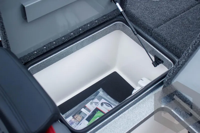 Slide: The Image of Storage compartment in 2025 Caymas CX 21 PRO boat, featuring organized space and accessories. - 46