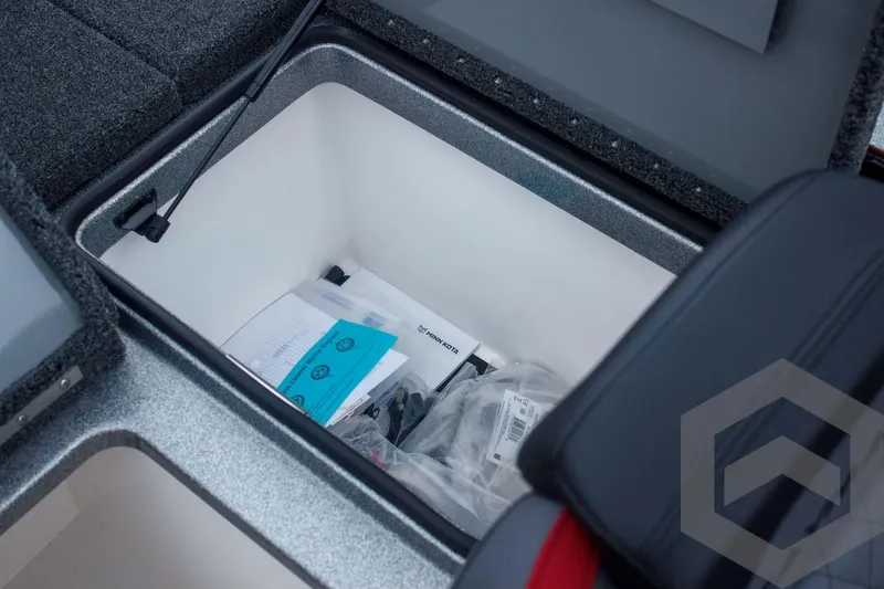 Slide: The Image of Storage compartment of 2025 Caymas CX 21 PRO boat, containing documents and accessories. - 47