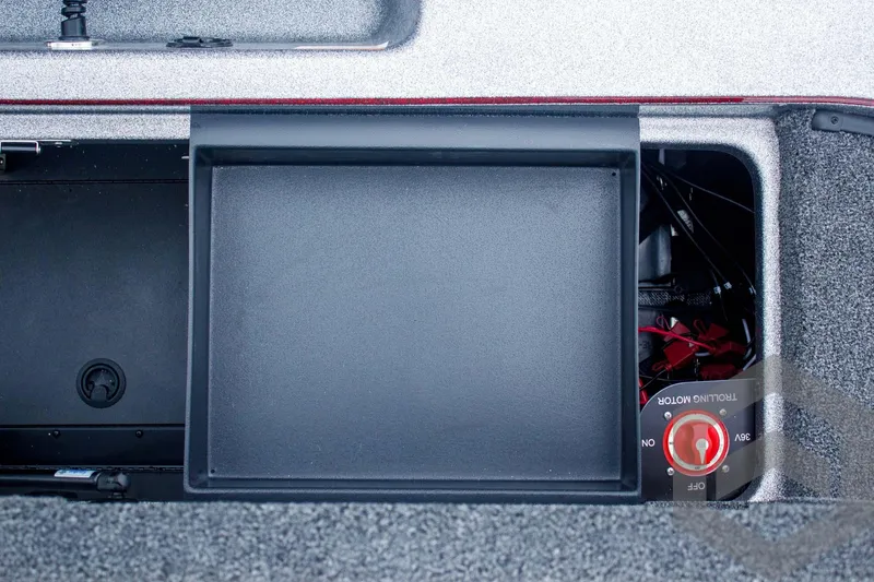 Slide: The Image of 2025 Caymas CX 21 PRO boat storage compartment with battery switch. - 48