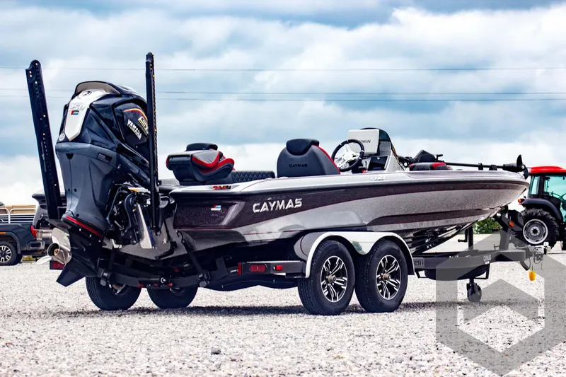 Slide: The Image of 2025 Caymas CX 21 PRO boat on trailer, featuring sleek design and powerful engine. - 5
