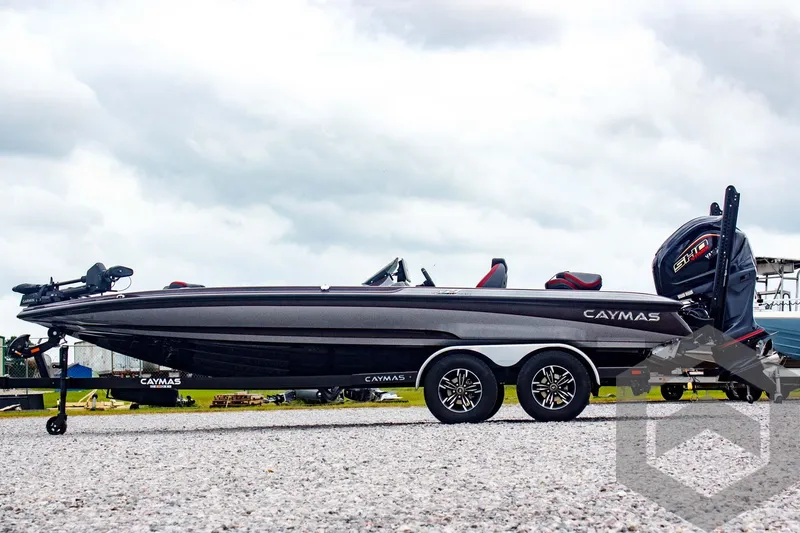 Slide: The Image of 2025 Caymas CX 21 PRO boat on trailer, side view, cloudy sky background. - 8