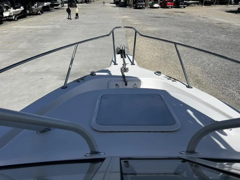Slide: The Image of Bow view of 2001 Pro-Line 27 Express boat in a marina setting. - 18