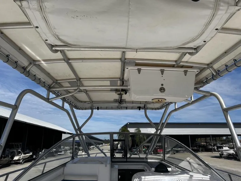Slide: The Image of 2001 Pro-Line 27 Express boat interior with canopy and storage compartment. - 9