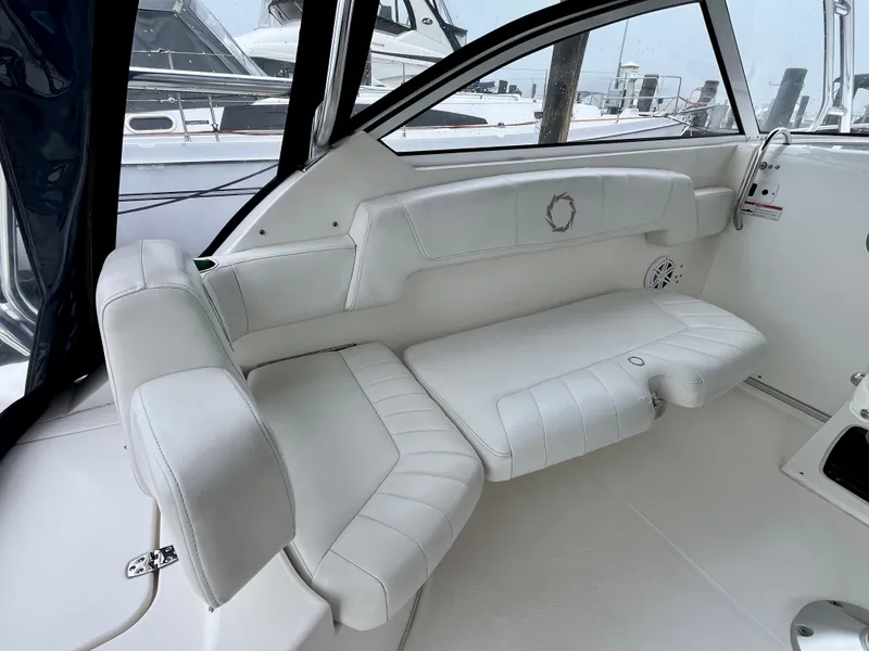 Slide: The Image of 2011 Fountain 38 Sportfish Cruiser interior with white leather seating. - 17