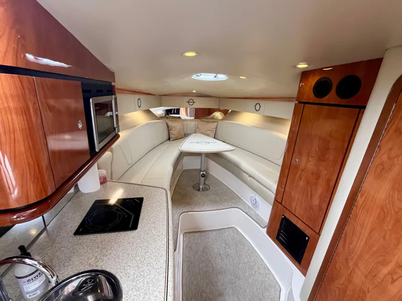 Slide: The Image of Interior of 2011 Fountain 38 Sportfish Cruiser with modern kitchen and cozy seating area. - 3