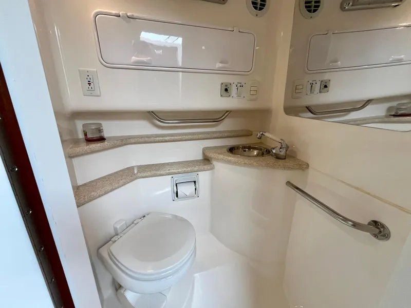 Slide: The Image of Bathroom interior of 2011 Fountain 38 Sportfish Cruiser with toilet and sink. - 30