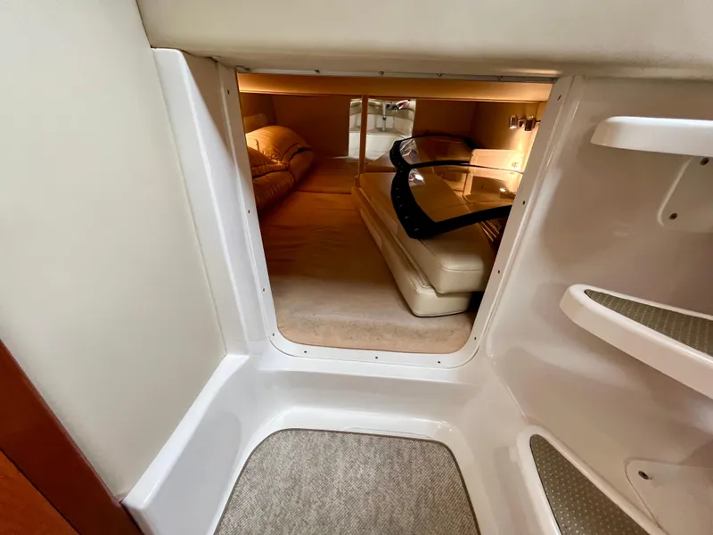 Slide: The Image of 2011 Fountain 38 Sportfish Cruiser cabin interior with cozy sleeping area and modern design. - 34
