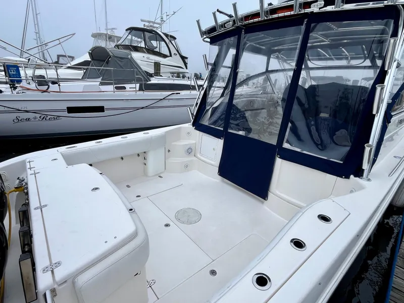 Slide: The Image of 2011 Fountain 38 Sportfish Cruiser with spacious deck at marina. - 4