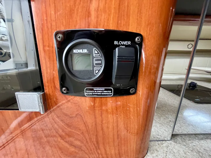 Slide: The Image of Kohler control panel on 2011 Fountain 38 Sportfish Cruiser, featuring blower switch. - 42