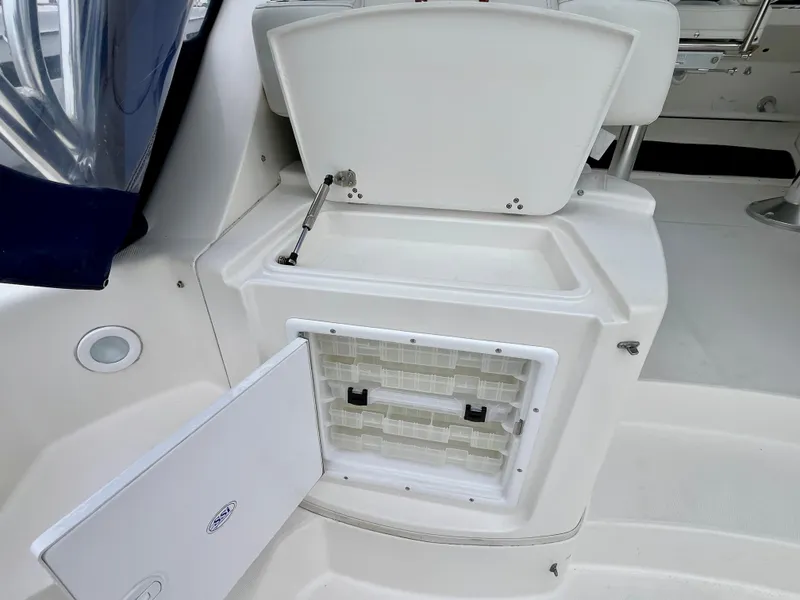 Slide: The Image of 2011 Fountain 38 Sportfish Cruiser interior with open storage compartment. - 44