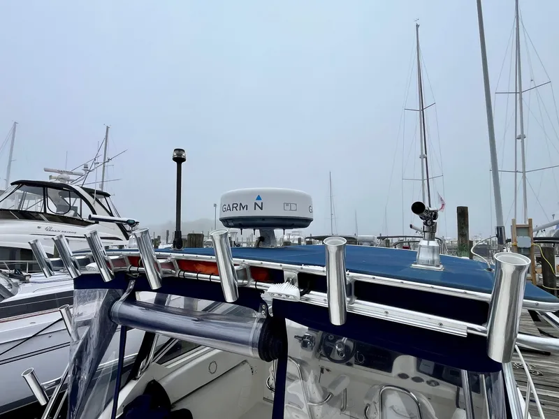 Slide: The Image of 2011 Fountain 38 Sportfish Cruiser docked with radar equipment visible. - 46