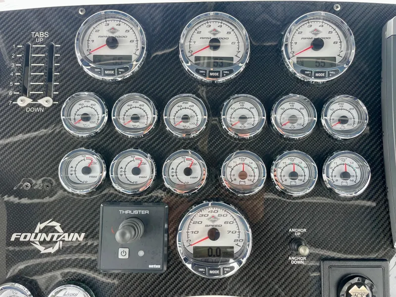 Slide: The Image of Dashboard of 2011 Fountain 38 Sportfish Cruiser with multiple gauges and controls. - 49