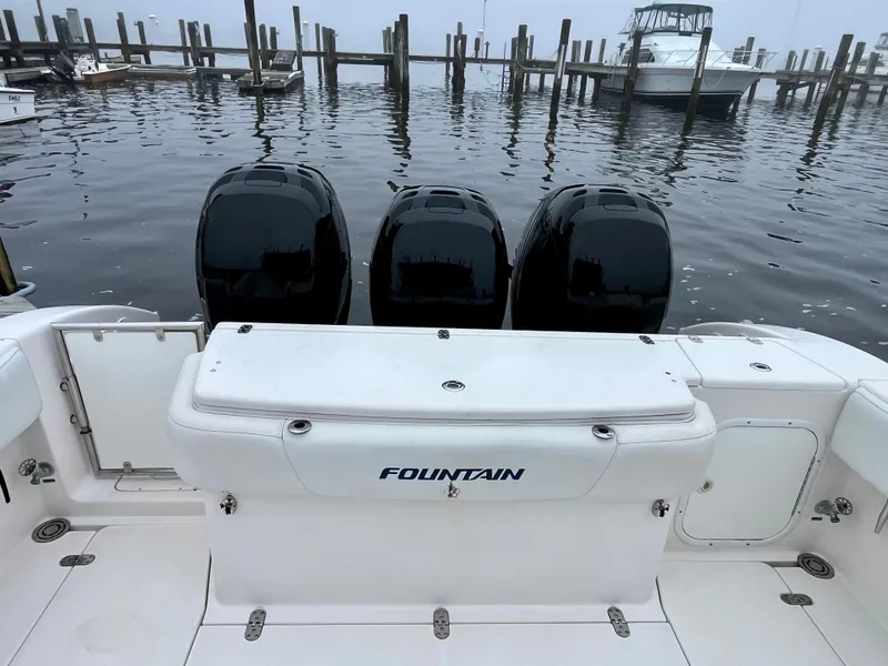 Slide: The Image of 2011 Fountain 38 Sportfish Cruiser with triple engines docked at marina. - 8