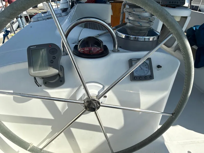 Slide: The Image of Steering wheel and navigation instruments on a 1997 Beneteau 50 yacht. - 20