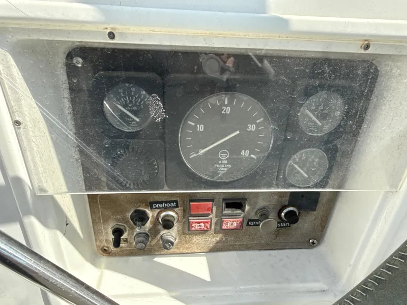 Slide: The Image of Control panel of a 1997 Beneteau 50 sailboat with gauges and switches. - 23
