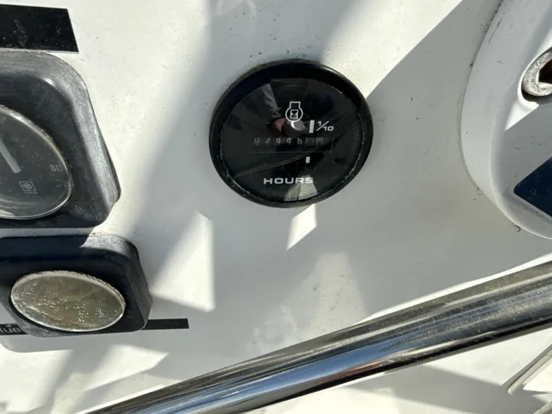 Slide: The Image of Close-up of a 1997 Beneteau 50 boat's hour meter gauge on the dashboard. - 25