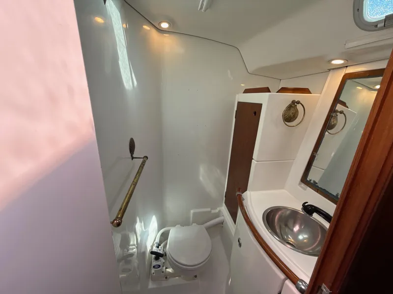 Slide: The Image of Bathroom interior of a 1997 Beneteau 50 yacht, featuring a sink and toilet. - 45