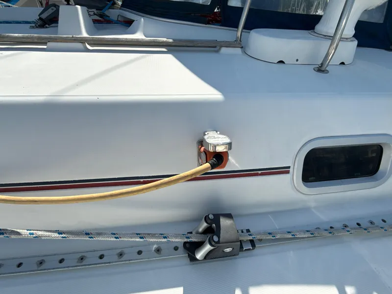 Slide: The Image of Deck of 1997 Beneteau 50 sailboat with power connection and rigging details. - 8