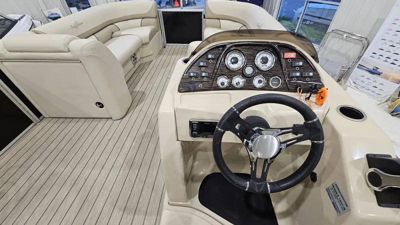 Slide: The Image of 2019 SunChaser Eclipse 8525 Entertainer boat interior with steering console and seating area. - 15