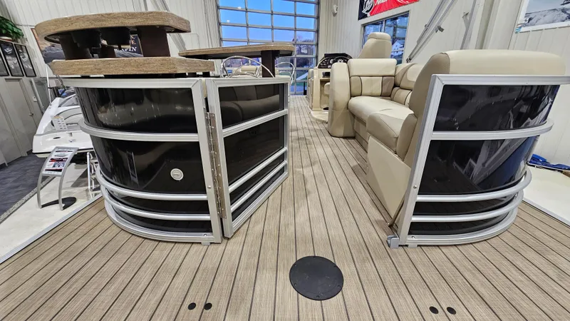 Slide: The Image of 2019 SunChaser Eclipse 8525 Entertainer pontoon boat interior with luxurious seating and wood-style flooring. - 21