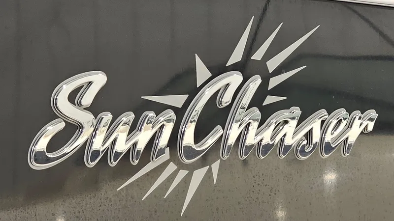 Slide: The Image of SunChaser Eclipse 8525 Entertainer 2019 logo with sunburst design on dark background. - 25
