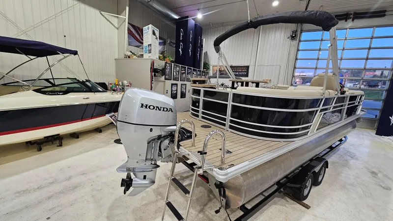 Slide: The Image of 2019 SunChaser Eclipse 8525 Entertainer pontoon boat with Honda outboard motor in showroom. - 6