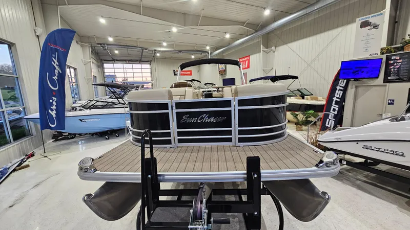 Slide: The Image of 2019 SunChaser Eclipse 8525 Entertainer pontoon boat displayed in a showroom. - 7
