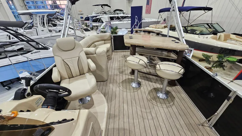 Slide: The Image of 2019 SunChaser Eclipse 8525 Entertainer pontoon boat interior with seating and table. - 9