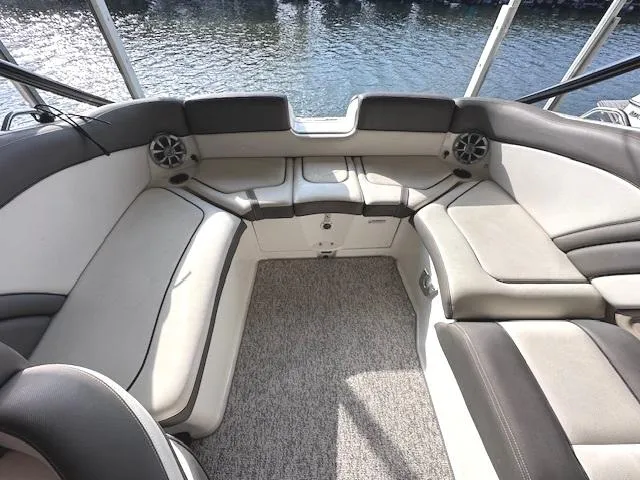 Slide: The Image of 2012 Yamaha Boats 242 Limited S interior with spacious seating and water view. - 12