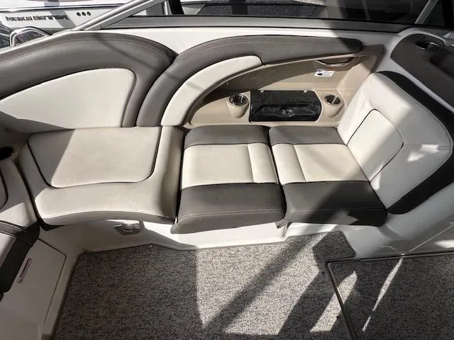 Slide: The Image of 2012 Yamaha Boats 242 Limited S interior seating with beige and black upholstery. - 14