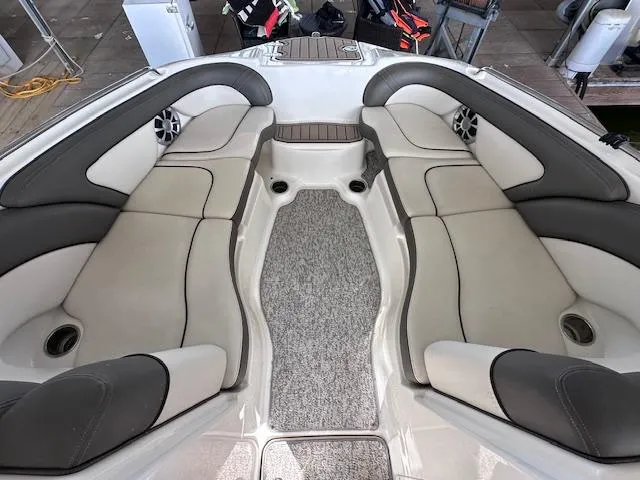 Slide: The Image of 2012 Yamaha Boats 242 Limited S interior with spacious seating and modern design. - 17