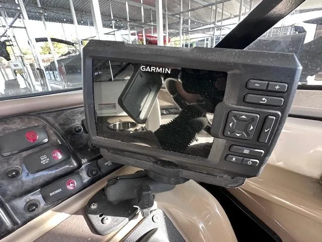 Slide: The Image of Garmin navigation system on 2012 Yamaha Boats 242 Limited S dashboard. - 21