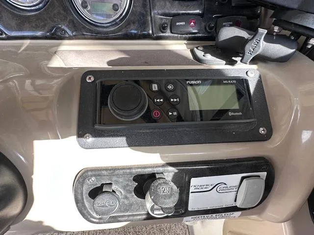 Slide: The Image of Control panel of a 2012 Yamaha Boats 242 Limited S with Fusion MS-RA205 stereo system. - 22