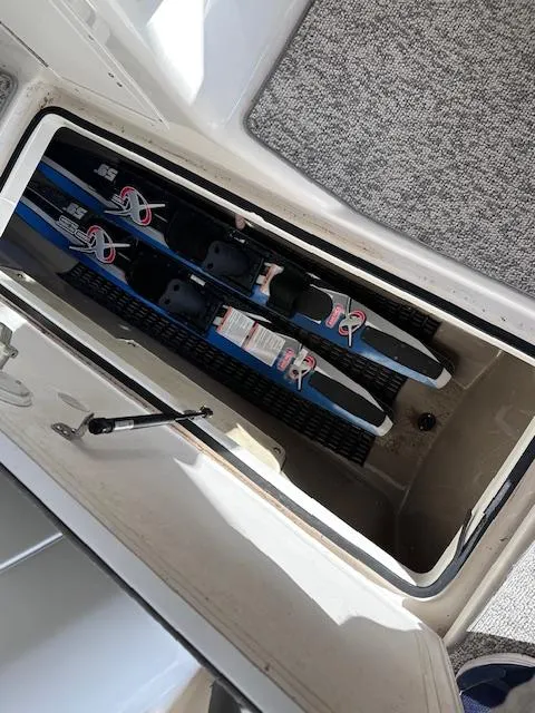 Slide: The Image of Storage compartment with water skis in a 2012 Yamaha Boats 242 Limited S. - 27
