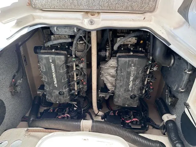 Slide: The Image of 2012 Yamaha Boats 242 Limited S engine compartment with dual high-output engines. - 28