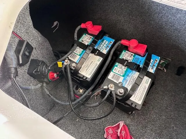 Slide: The Image of Batteries in a 2012 Yamaha Boats 242 Limited S, securely installed with wiring. - 30