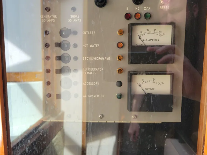 Slide: The Image of Electrical control panel on a 1989 Sea Ray 340 Sundancer boat. - 23