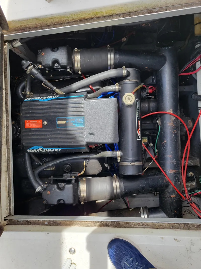Slide: The Image of Engine compartment of a 1989 Sea Ray 340 Sundancer boat, featuring a MerCruiser engine. - 40