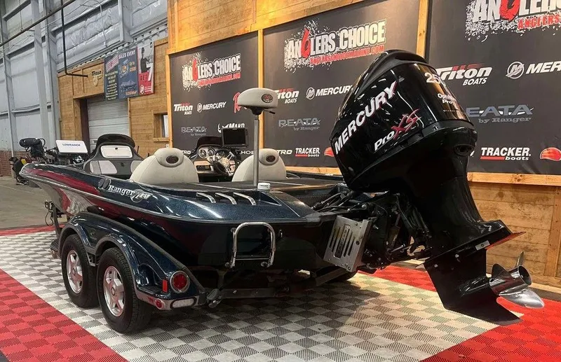 Slide: The Image of 2008 Ranger Z21 boat with Mercury Pro XS engine on display indoors. - 3