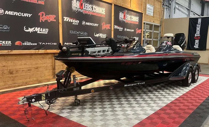 Slide: The Image of 2008 Ranger Z21 boat on display in showroom with branded backdrop. - 4