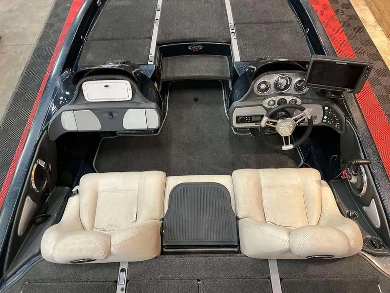 Slide: The Image of 2008 Ranger Z21 boat interior with dual seats, steering console, and dashboard controls. - 5