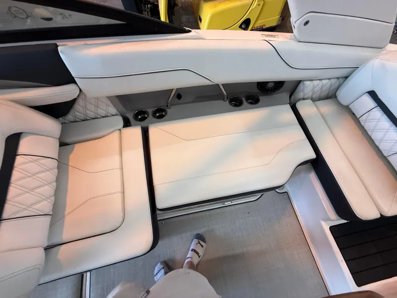 Slide: The Image of Luxurious interior seating of 2024 Regal LX2 boat with white upholstery and modern design. - 19