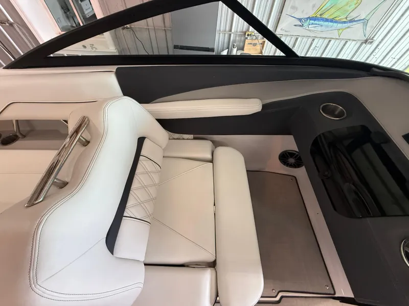 Slide: The Image of 2024 Regal LX2 boat interior with white seating and sleek design. - 24