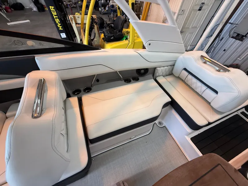 Slide: The Image of 2024 Regal LX2 boat interior with luxurious white seating and modern design. - 27