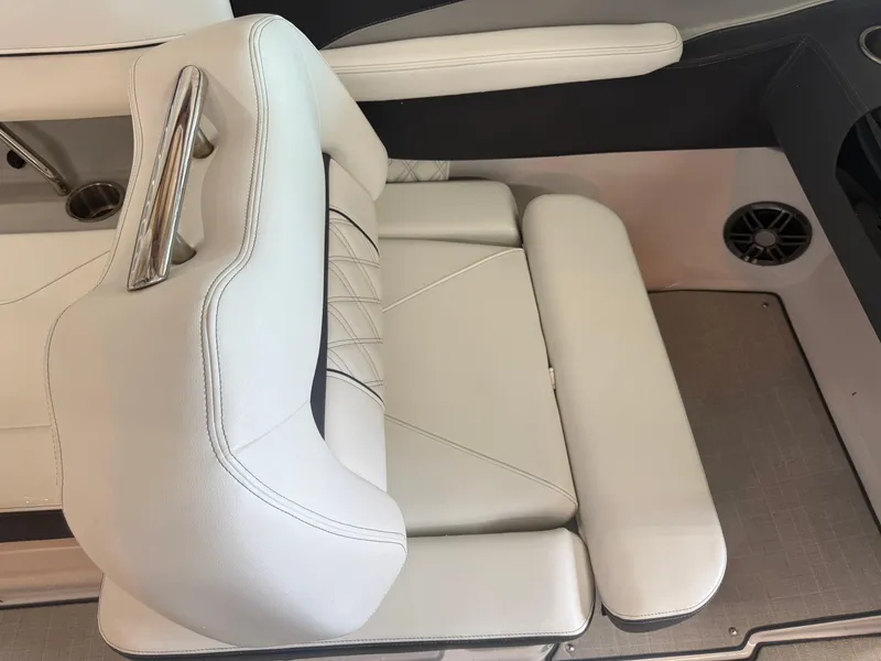Slide: The Image of 2024 Regal LX2 boat seat with white upholstery and modern design. - 31