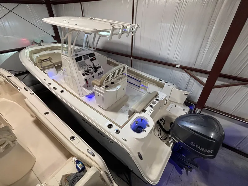 Slide: The Image of 2019 Sailfish 241 CC boat with Yamaha engine in storage facility. - 1
