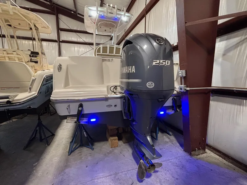 Slide: The Image of 2019 Sailfish 241 CC boat with Yamaha 250 engine in storage facility. - 10