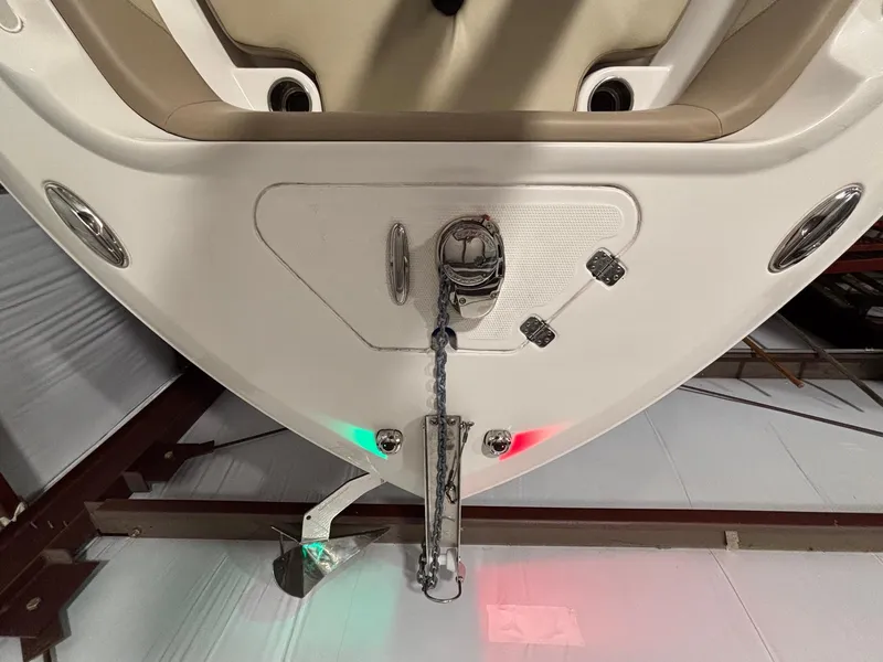 Slide: The Image of 2019 Sailfish 241 CC boat bow with anchor and navigation lights in storage. - 12