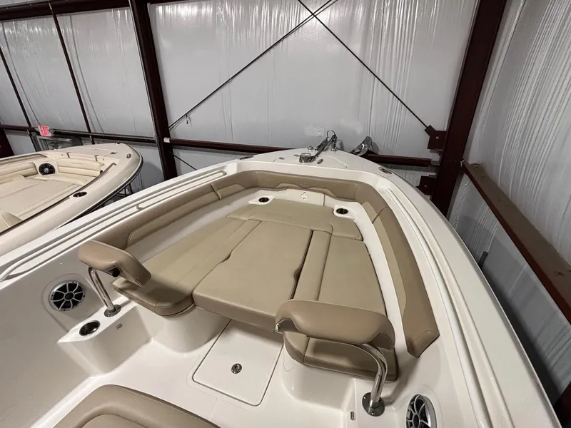 Slide: The Image of 2019 Sailfish 241 CC boat interior with beige seating in storage facility. - 13