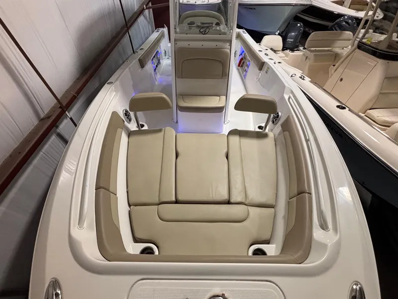 Slide: The Image of 2019 Sailfish 241 CC boat interior with beige seating and modern design. - 16